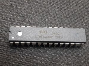 कॉपी सिक्योर्ड माइक्रोकंट्रोलर ATMEL ATmega48P फ्लैश एक खास टेक्निकल सर्विस है जिसे सिक्योर्ड या लॉक्ड ATMEL ATmega48P माइक्रोप्रोसेसर से बाइनरी या हेक्सिमल फर्मवेयर फाइलें निकालने के लिए डिज़ाइन किया गया है। कई एम्बेडेड प्रोडक्ट्स में, ATMEL ATmega48P लॉक्ड MCU की फ्लैश मेमोरी के अंदर स्टोर फर्मवेयर में ऑपरेशनल प्रोग्राम, कंट्रोल एल्गोरिदम और डिवाइस कम्युनिकेशन लॉजिक होते हैं। जब सिक्योरिटी फ्यूज बिट्स चालू होते हैं, तो चिप सुरक्षित हो जाती है और आम प्रोग्रामिंग टूल अंदरूनी फ्लैश या EEPROM मेमोरी एरिया को खोल या पढ़ नहीं सकते। ऐसे हालात में, माइक्रोप्रोसेसर से ओरिजिनल एन्क्रिप्टेड ATMEL ATmega48P फर्मवेयर आर्काइव को निकालने, रिकवर करने और रिस्टोर करने के लिए प्रोफेशनल रिवर्स इंजीनियरिंग तकनीकों की ज़रूरत होती है। इसका मकसद प्रोग्राम मेमोरी का एक जैसा बाइनरी डंप पाना है, साथ ही स्टोर्ड डेटा का स्ट्रक्चर भी बनाए रखना है और सिक्योर्ड ATMEL ATmega48P MCU को खराब होने से बचाना है।
